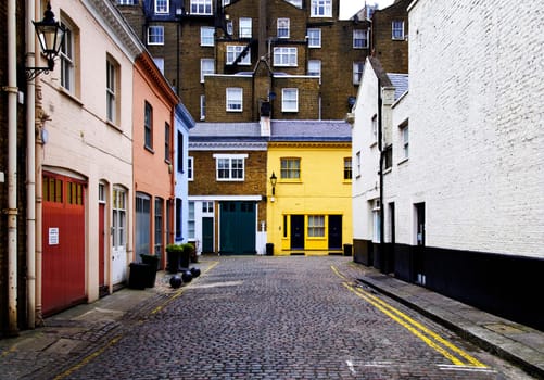 Cobbled street and colorful brick houses in London, England, UK