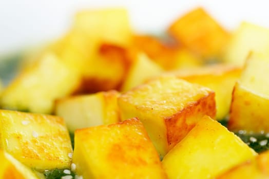 Fried paneer with sesame seed and spinach