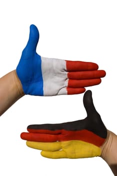 two painted hands with the german and the french flag