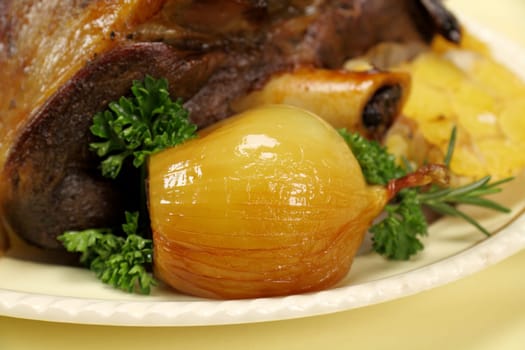 Delicious baked onion served with a leg of lamb.