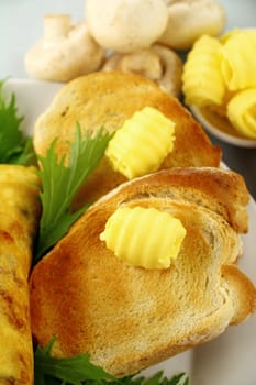 Curled butter knobs on toast ready to serve.
