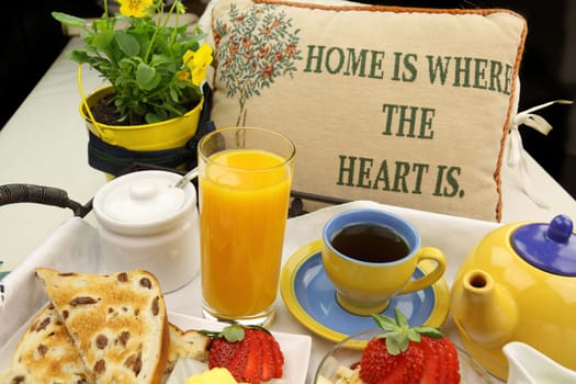Breakfast with tea, orange juice, toast and muesli ready to serve.