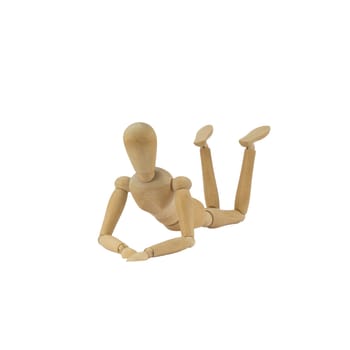 Wooden female figure is lying on her belly