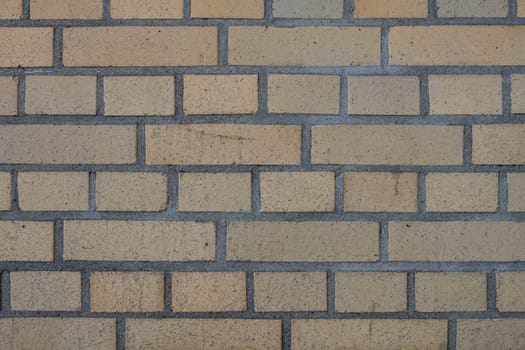 a yellow brickwall from an industry building