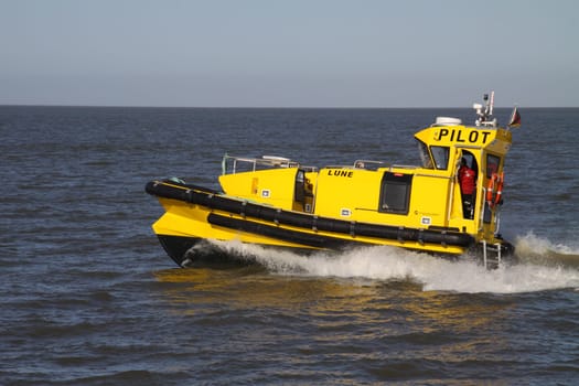 Yellow pilot boat on the North Sea