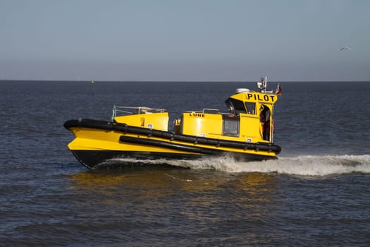 Yellow pilot boat on the North Sea