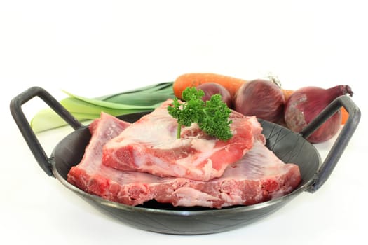two pieces of peeled ribs against a white background