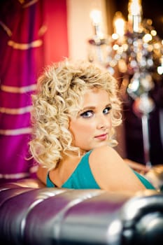 Beautiful young woman looking over shoulder