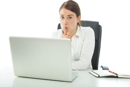 brunette young woman holding finger mouth sign quiet