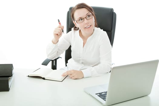 young brunette businesswoman with glasses on desk has idea