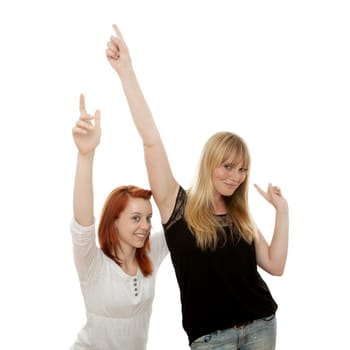 young beautiful red and blond haired girls in front of white background