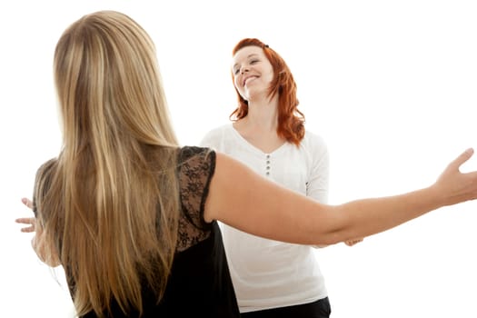 young beautiful red and blond haired girls in front of white background