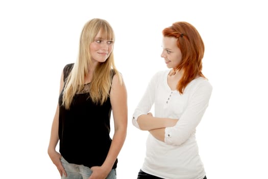 young beautiful red and blond haired girls in front of white background