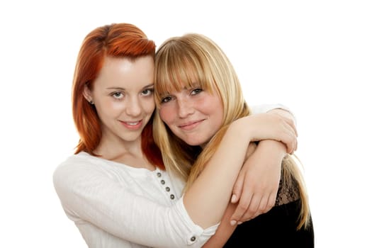young beautiful red and blond haired girls in front of white background
