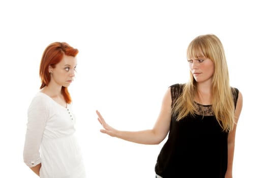 young beautiful red and blond haired girls in front of white background