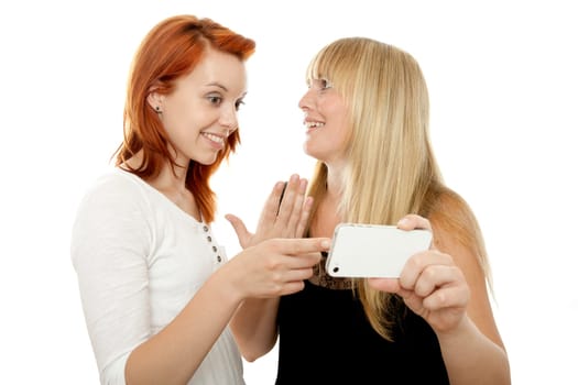 young beautiful red and blond haired girls in front of white background