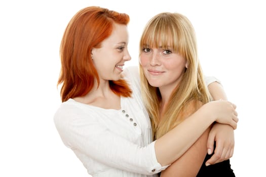 young beautiful red and blond haired girls in front of white background