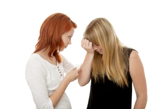 young beautiful red and blond haired girls in front of white background