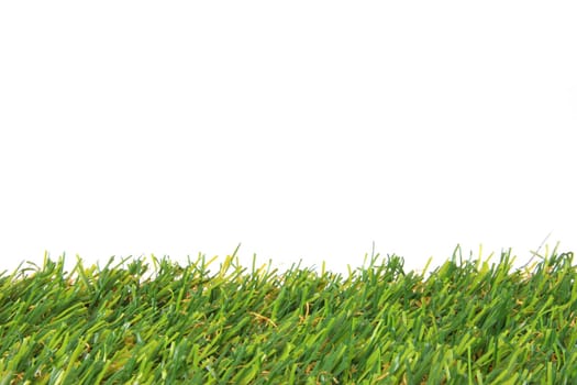 Artificial grass against a white background