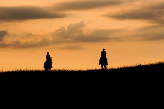 Image of the romantic horseback ride - couple on the horses