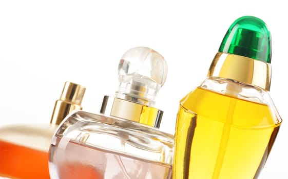 Composition with perfume bottles on white background