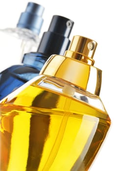 Composition with perfume bottles on white background
