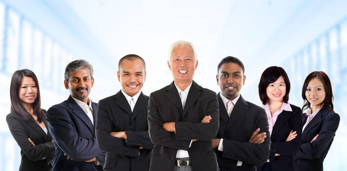 Asian business team in multiracial. Diversity business people form by different races, Indian, Malay, Indonesian, Chinese standing in office environment.