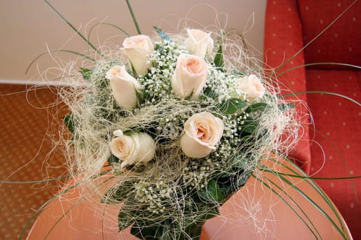 Bouquet of flowers in vase on the table.