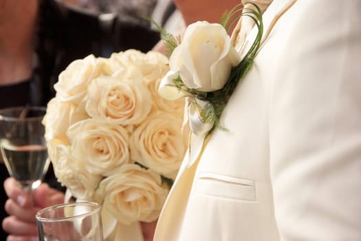 Boutonniere and wedding bouquet