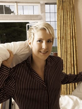 Beautiful girl in pyjamas ready for a pillow fight