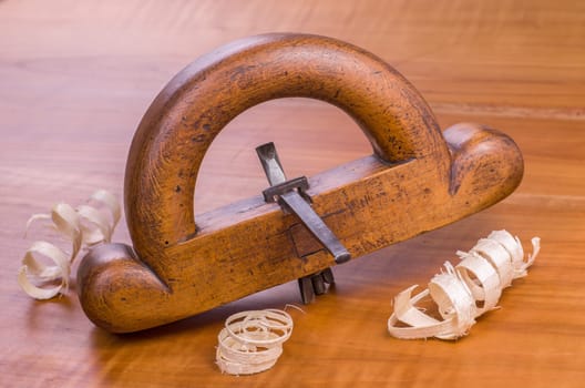 old ground plane with shavings on a cherry wood plate