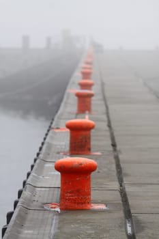 Row of bollards in the fog on Heligoland