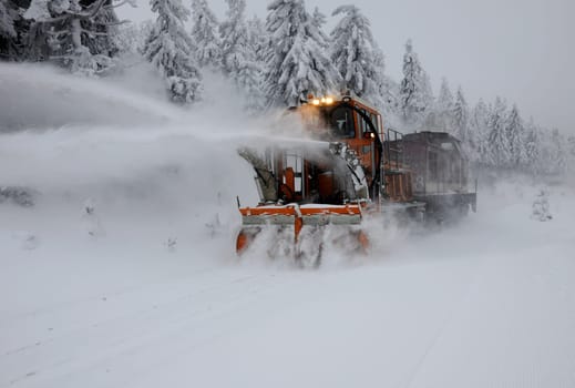 The rail snow blower of the Harz Narrow Gauge Railway is supported by a pushing diesel locomotive. Taken on the Brocken