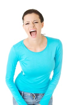 Young casual woman screaming with anger, isolated on white
