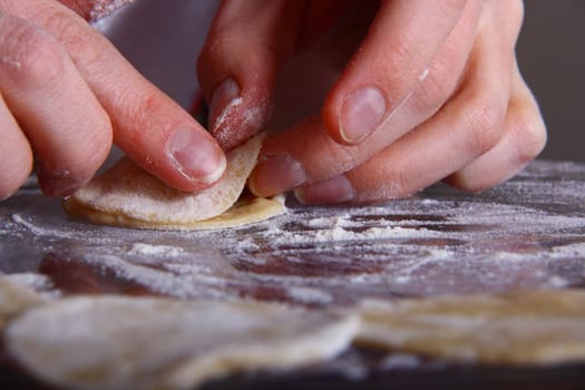 hand made ravioli getting prepared on table