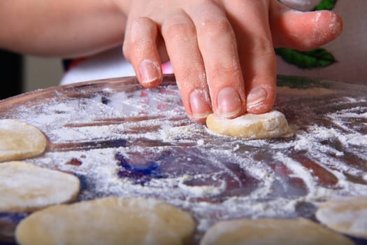 hand made ravioli getting prepared on table