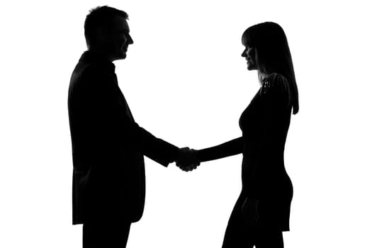 one caucasian couple man and woman handshake in studio silhouette isolated on white background