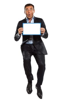 one caucasian surprised business man  jumping holding showing whiteboard in studio isolated on white background