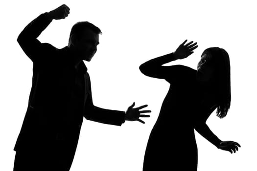one caucasian couple man and woman expressing domestic violence in studio silhouette isolated on white background