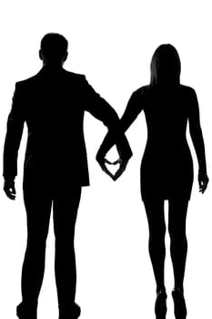 one lovers caucasian couple man and woman walking hand in hand in studio silhouette isolated on white background