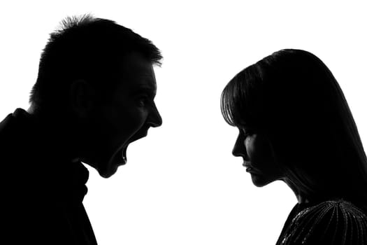 one caucasian couple man and woman face to face screaming shouting dipute in studio silhouette isolated on white background