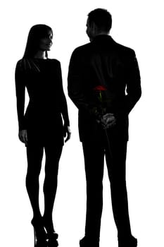 one caucasian couple man and woman smiling in studio silhouette isolated on white background
