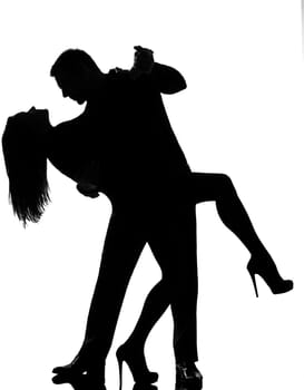 one caucasian couple lovers  man and woman dancing tango in studio silhouette isolated on white background