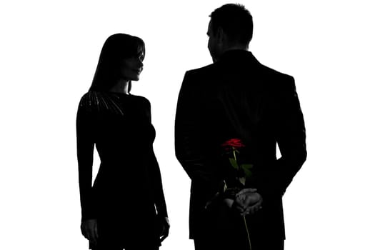 one caucasian couple man and woman smiling in studio silhouette isolated on white background