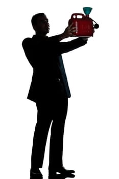 one caucasian man out of gas holding can  full length silhouette in studio isolated white background