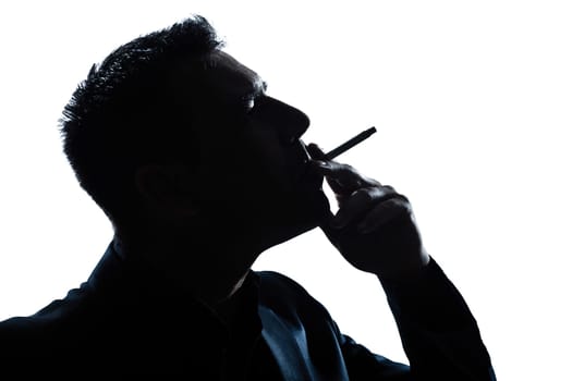 one caucasian man portrait smoking cigarette silhouette in studio isolated white background
