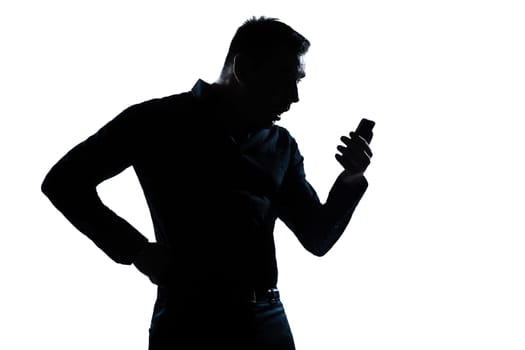 one caucasian man surprised telephone videophone  portrait silhouette in studio isolated white background