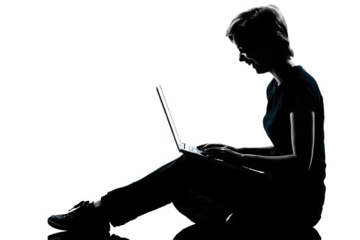 one caucasian young teenager silhouette  girl computer computing laptop laughing full length in studio cut out isolated on white background