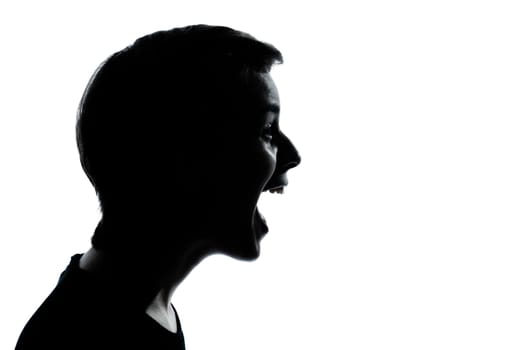 one caucasian young teenager silhouette boy or girl laughing portrait in studio cut out isolated on white background