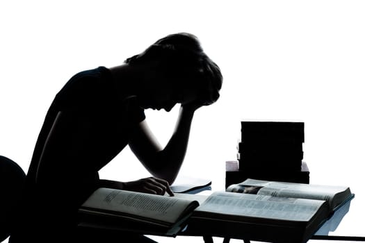 one caucasian young teenager silhouette boy girl studying tired reading books in studio cut out isolated on white background